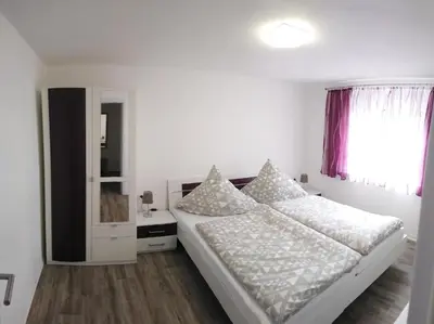 Ein Bett oder Betten in einem Zimmer der Unterkunft Haus Waldidyll