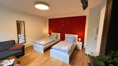 Ein Bett oder Betten in einem Zimmer der Unterkunft Ferienwohnung König Georg