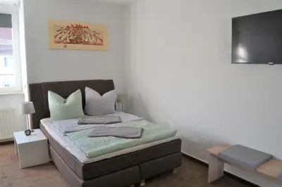 Ein Bett oder Betten in einem Zimmer der Unterkunft Penthouse Himmelreich großzügige Maisonette auf 152 qm mit Klima & Kamin