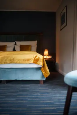 Ein Bett oder Betten in einem Zimmer der Unterkunft QUARTIER 5 Hotel & Restaurant, Sächsische Schweiz