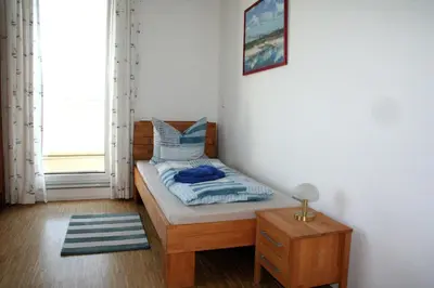 Ein Bett oder Betten in einem Zimmer der Unterkunft Ferienwohnung Penthaus ILSE