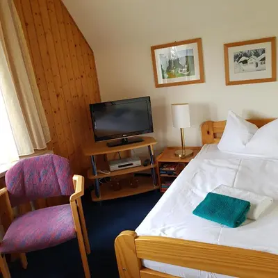 Ein Bett oder Betten in einem Zimmer der Unterkunft Ferienwohnung Heinrich