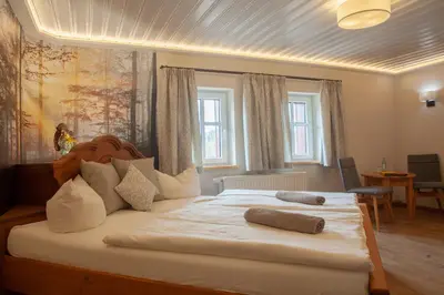 Ein Bett oder Betten in einem Zimmer der Unterkunft Naturhotel Gasthof Bärenfels