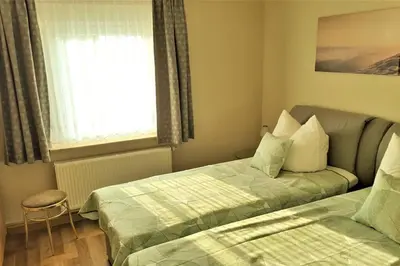 Ein Bett oder Betten in einem Zimmer der Unterkunft Fewo Radeberg