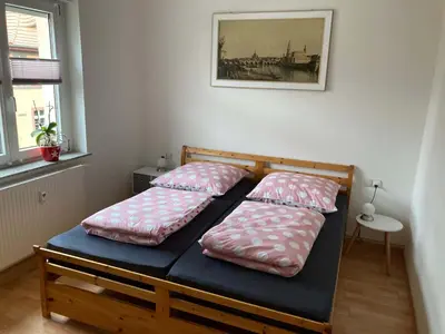Ein Bett oder Betten in einem Zimmer der Unterkunft Ferienwohnung Tapetenwechsel -Balkon-