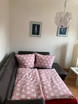 Ein Bett oder Betten in einem Zimmer der Unterkunft Ferienwohnung Tapetenwechsel -Balkon-