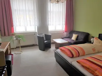 Ein Bett oder Betten in einem Zimmer der Unterkunft Pension Zur Altdeutschen