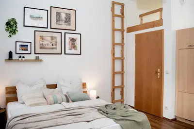 Ein Bett oder Betten in einem Zimmer der Unterkunft Stilvolle 1-Raum-Wohnung zentral, ruhig gelegen