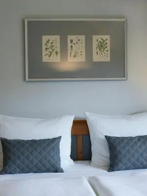 Ein Bett oder Betten in einem Zimmer der Unterkunft Schloss Hotel Dresden Pillnitz