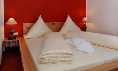 Ein Bett oder Betten in einem Zimmer der Unterkunft Hotel Goldener Stern