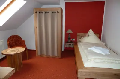 Ein Bett oder Betten in einem Zimmer der Unterkunft Hotel Goldener Stern