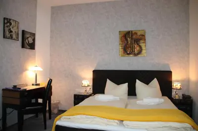Ein Bett oder Betten in einem Zimmer der Unterkunft Boulevardhotel Sängerstadt - alle Zimmer klimatisiert