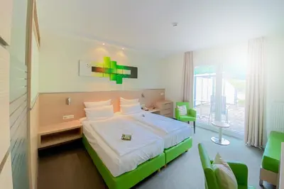 Ein Bett oder Betten in einem Zimmer der Unterkunft aktiv Sporthotel Sächsische Schweiz