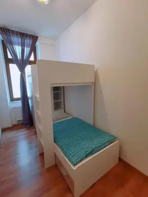 Ein Bett oder Betten in einem Zimmer der Unterkunft Familienfreundliches Apartment im Zentrum für Geschäftsreisen und privat