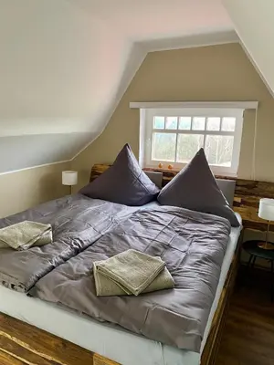 Ein Bett oder Betten in einem Zimmer der Unterkunft Ferienhaus Ostrauer Hof