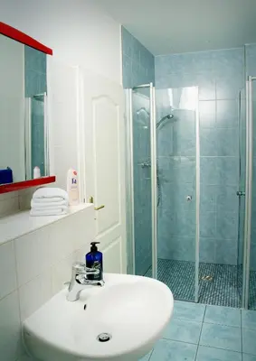 Ein Badezimmer in der Unterkunft Apartmenthaus Stadt Metz