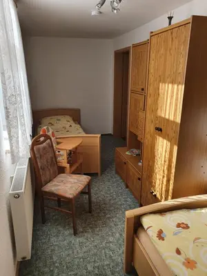Ein Bett oder Betten in einem Zimmer der Unterkunft Alte Schäferei Bad Gottleuba