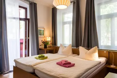 Ein Bett oder Betten in einem Zimmer der Unterkunft Pension an der Pillnitzer Schlossfähre