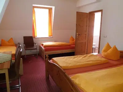 Ein Bett oder Betten in einem Zimmer der Unterkunft Gästehaus Loschwitz
