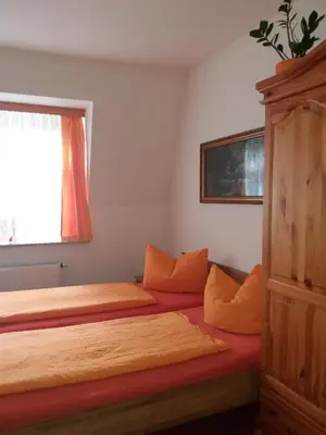 Ein Bett oder Betten in einem Zimmer der Unterkunft Gästehaus Loschwitz