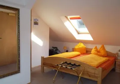 Ein Bett oder Betten in einem Zimmer der Unterkunft Gästehaus Loschwitz