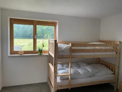 Ein Bett oder Betten in einem Zimmer der Unterkunft Ferienwohnung an der Reitanlage