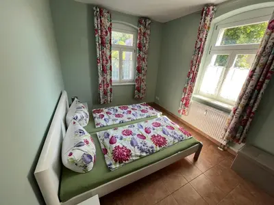 Ein Bett oder Betten in einem Zimmer der Unterkunft Quartier am Nationalparkhaus