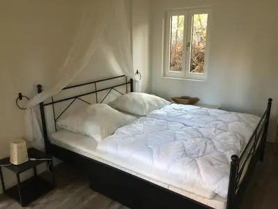 Ein Bett oder Betten in einem Zimmer der Unterkunft lauch3 - Ferienhäuser am See