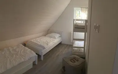 Ein Bett oder Betten in einem Zimmer der Unterkunft lauch3 - Ferienhäuser am See