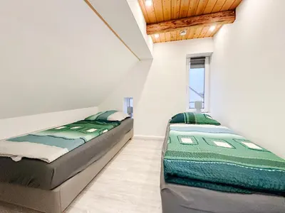 Ein Bett oder Betten in einem Zimmer der Unterkunft Ferienwohnung3 Grimma