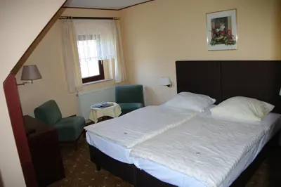 Ein Bett oder Betten in einem Zimmer der Unterkunft Landhotel Goldener Löwe