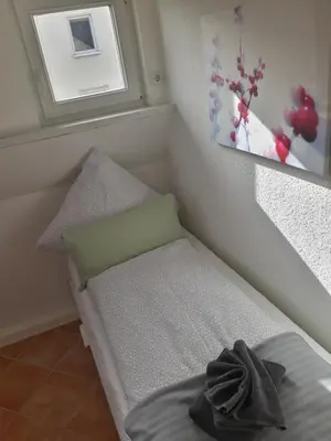 Ein Bett oder Betten in einem Zimmer der Unterkunft Ferienwohnung Katrin - nahe Chemnitz