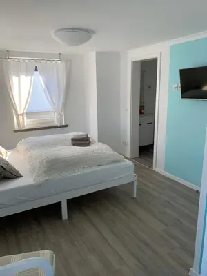 Ein Bett oder Betten in einem Zimmer der Unterkunft Pension Unikum Waldheim