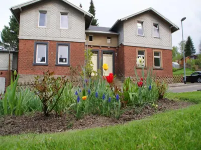 Ein Garten an der Unterkunft Ferienhaus in Rechenberg-Bienemuehle