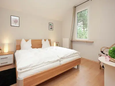Ein Bett oder Betten in einem Zimmer der Unterkunft Ferienhaus in Rechenberg-Bienemuehle