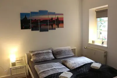 Ein Bett oder Betten in einem Zimmer der Unterkunft Zentralgelegene 4-Raum Ferienwohnung bis 8 Pers.