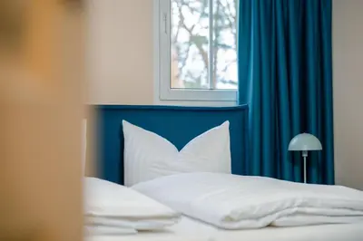 Ein Bett oder Betten in einem Zimmer der Unterkunft Waldidylle Gohrisch, Pension & Ferienwohnung Garni, Sächsische Schweiz
