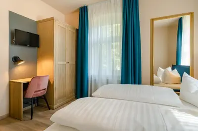 Ein Bett oder Betten in einem Zimmer der Unterkunft Waldidylle Gohrisch, Pension & Ferienwohnung Garni, Sächsische Schweiz
