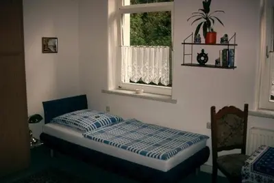 Ein Bett oder Betten in einem Zimmer der Unterkunft Hotel-Pension Königswald