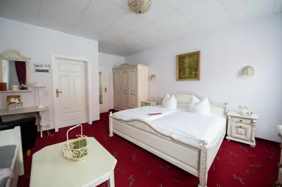 Ein Bett oder Betten in einem Zimmer der Unterkunft Hotel Zum Vetter
