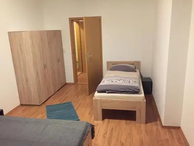 Ein Bett oder Betten in einem Zimmer der Unterkunft Ferienwohnung am Holzwurm