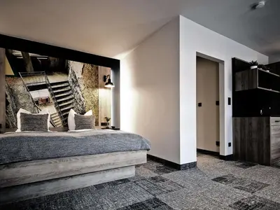 Ein Bett oder Betten in einem Zimmer der Unterkunft alexxanders Hotel & Boardinghouse, Restaurant