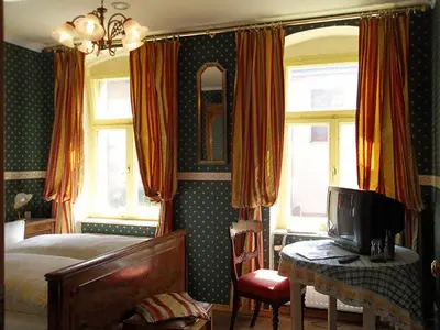 Ein Bett oder Betten in einem Zimmer der Unterkunft Wein-Hotel Auberge Mistral