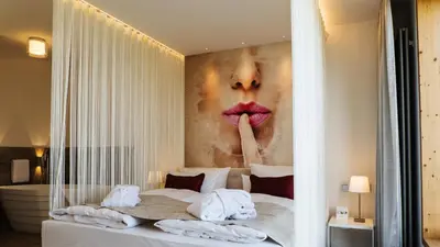 Ein Bett oder Betten in einem Zimmer der Unterkunft rugs Hotel am Schlosspark Lichtenwalde
