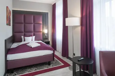 Ein Bett oder Betten in einem Zimmer der Unterkunft Hotel Chemnitzer Hof