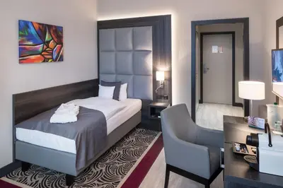 Ein Bett oder Betten in einem Zimmer der Unterkunft Hotel Chemnitzer Hof
