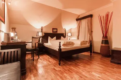 Ein Bett oder Betten in einem Zimmer der Unterkunft Hotel Aviv Dresden