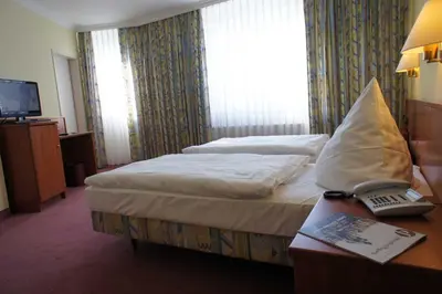 Ein Bett oder Betten in einem Zimmer der Unterkunft Hotel Pesterwitzer Siegel