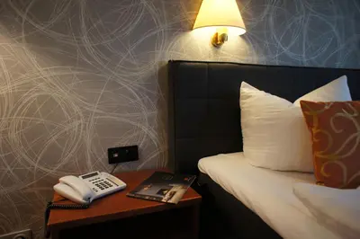 Ein Bett oder Betten in einem Zimmer der Unterkunft Hotel Pesterwitzer Siegel