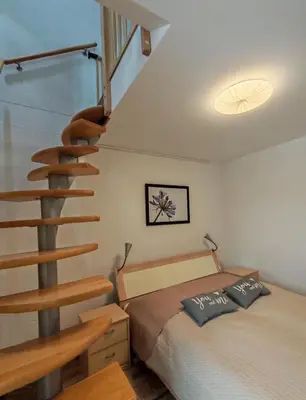 Ein Bett oder Betten in einem Zimmer der Unterkunft Ferienwohnung Am Elberadweg